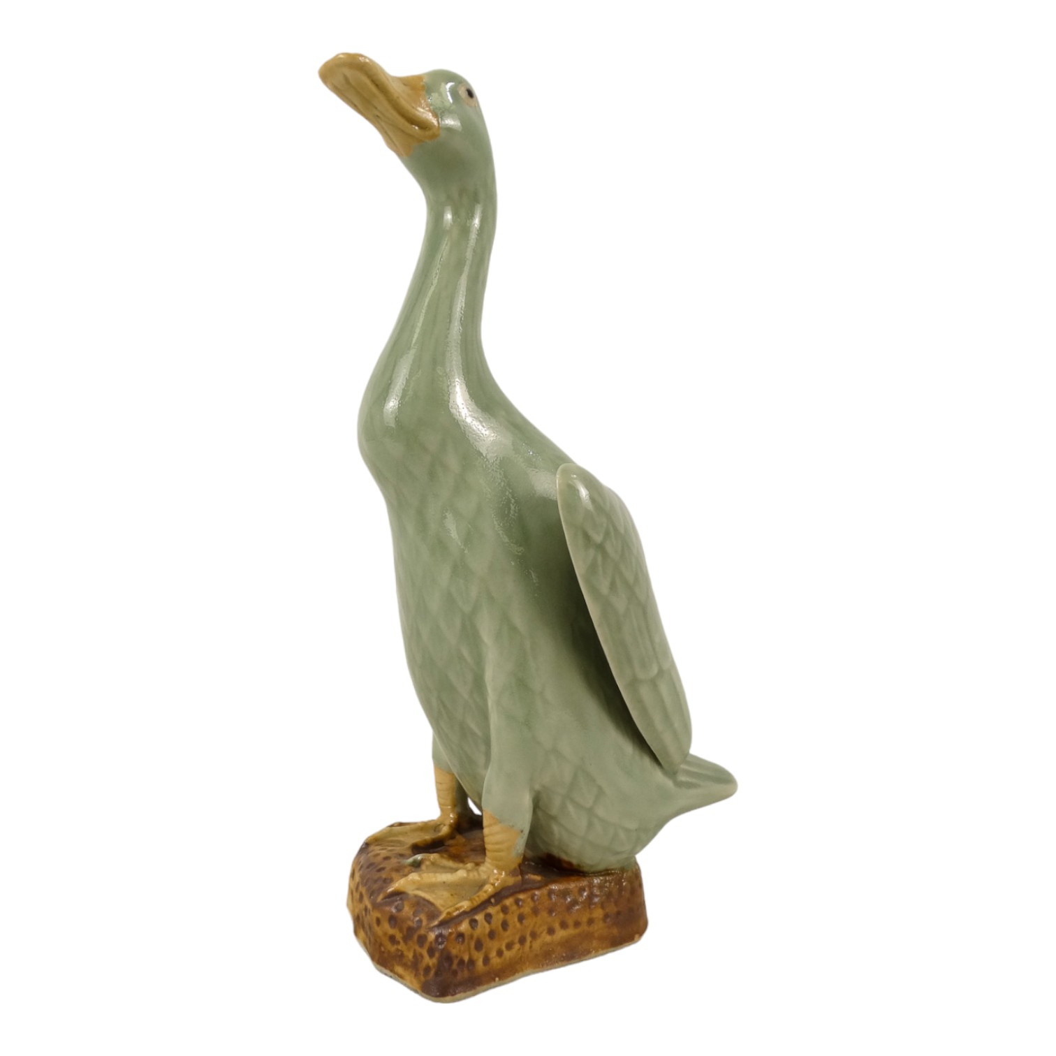 A Chinese figure of a running duck - green glazed, 24cm high