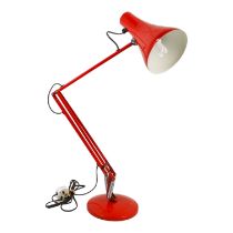 A red Anglepoise lamp - model 90, with a circular domed base