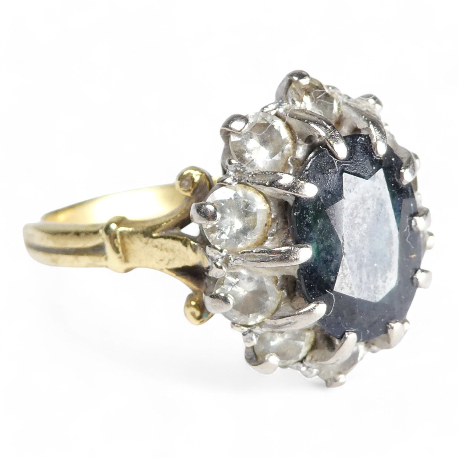 A 9ct sapphire and diamond ring - the claw set oval central stone within a band of diamonds, size R, - Image 3 of 6