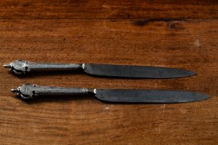 A rare pair of knives in engraved silver 'saints', 17th century (with inscriptions, coat of arms and