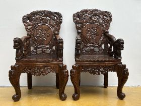 A pair of Japanese armchairs in carved wood 'dragons'