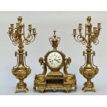 A three-piece clock set in gilt bronze, Louis XVI style