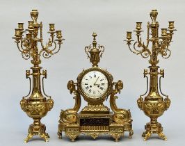 A three-piece clock set in gilt bronze, Louis XVI style