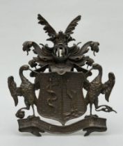 A bronze coat of arms of the Finnish noble family von Haartman with their motto 'Utrumque experient