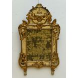 A mirror in sculpted wood, 18th century (*)