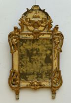 A mirror in sculpted wood, 18th century (*)