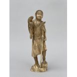 Japanese okimono 'beggar with parrot', Meiji period (signed) (*)