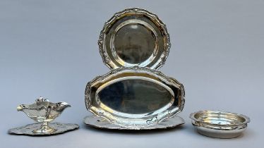 A collection of silver pieces: three dishes, vegetable tureen and sauce boat in Louis XV style