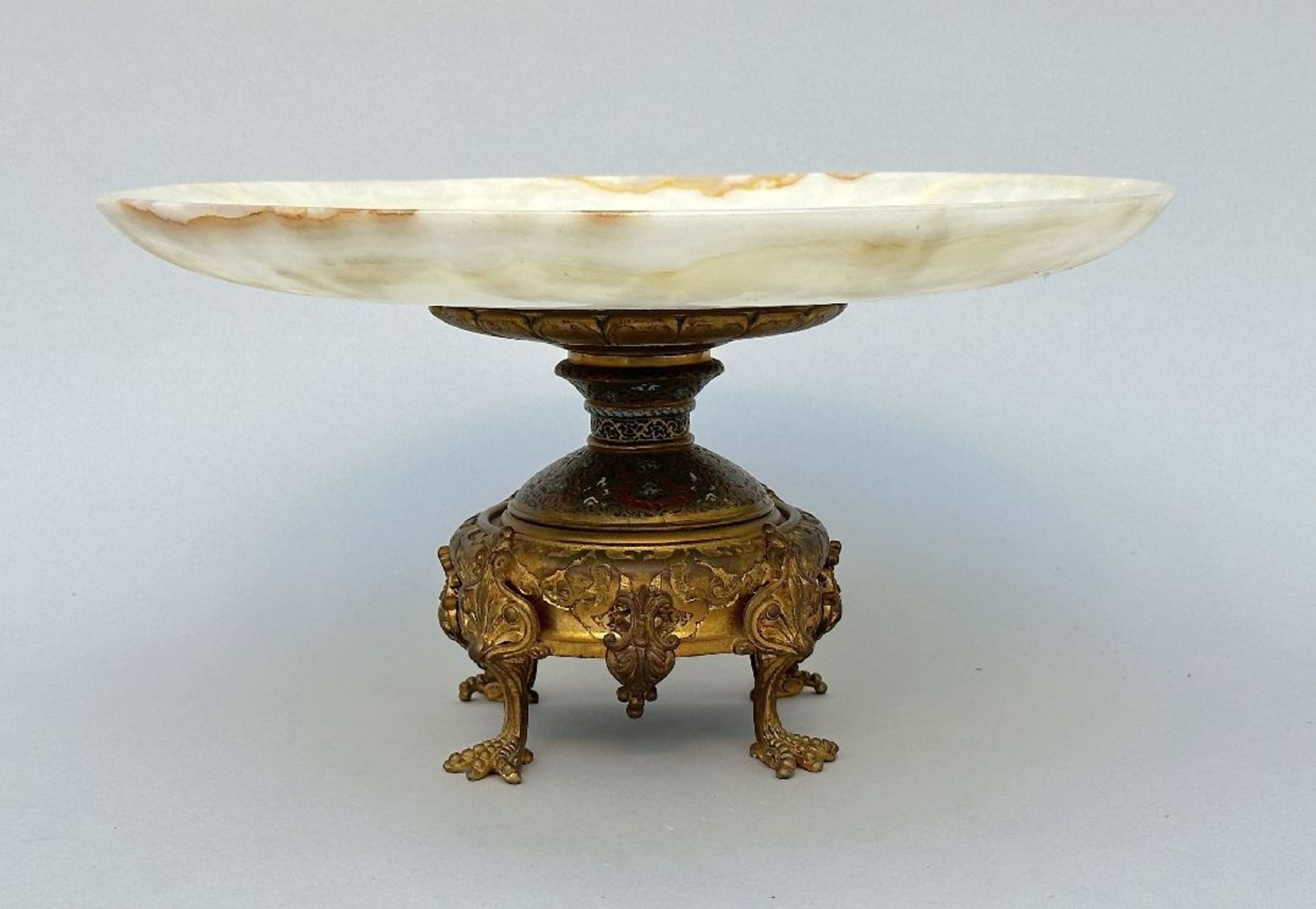 A decorative coupe in gilt bronze, onyx and champlevé