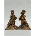 A pair of gilded cast iron figurines 'boy and girl', France 18th century
