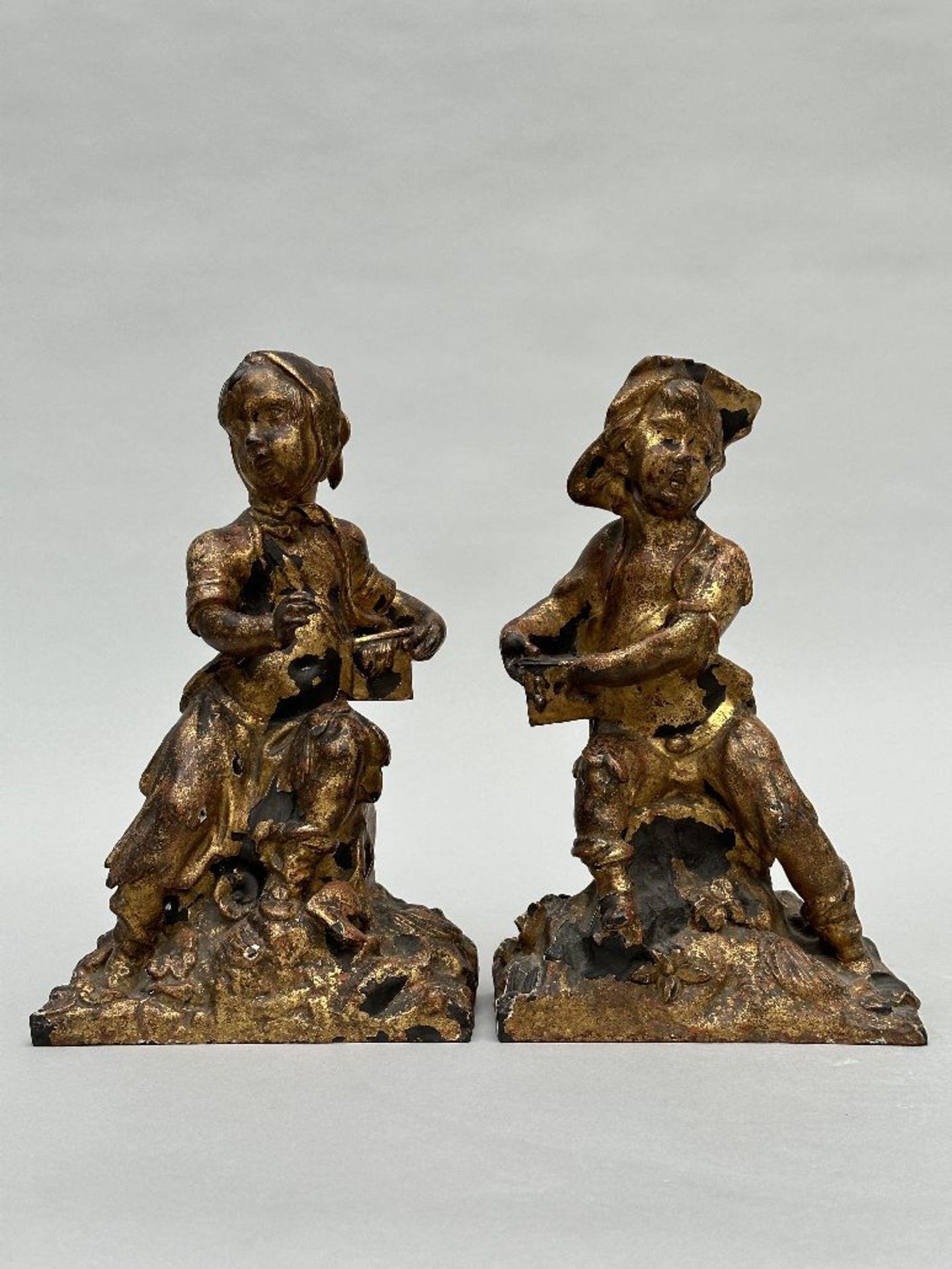 A pair of gilded cast iron figurines 'boy and girl', France 18th century