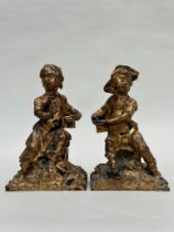 A pair of gilded cast iron figurines 'boy and girl', France 18th century