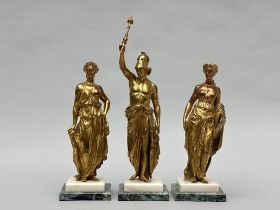 Three gilt bronze statues on marble base 'Greek gods'