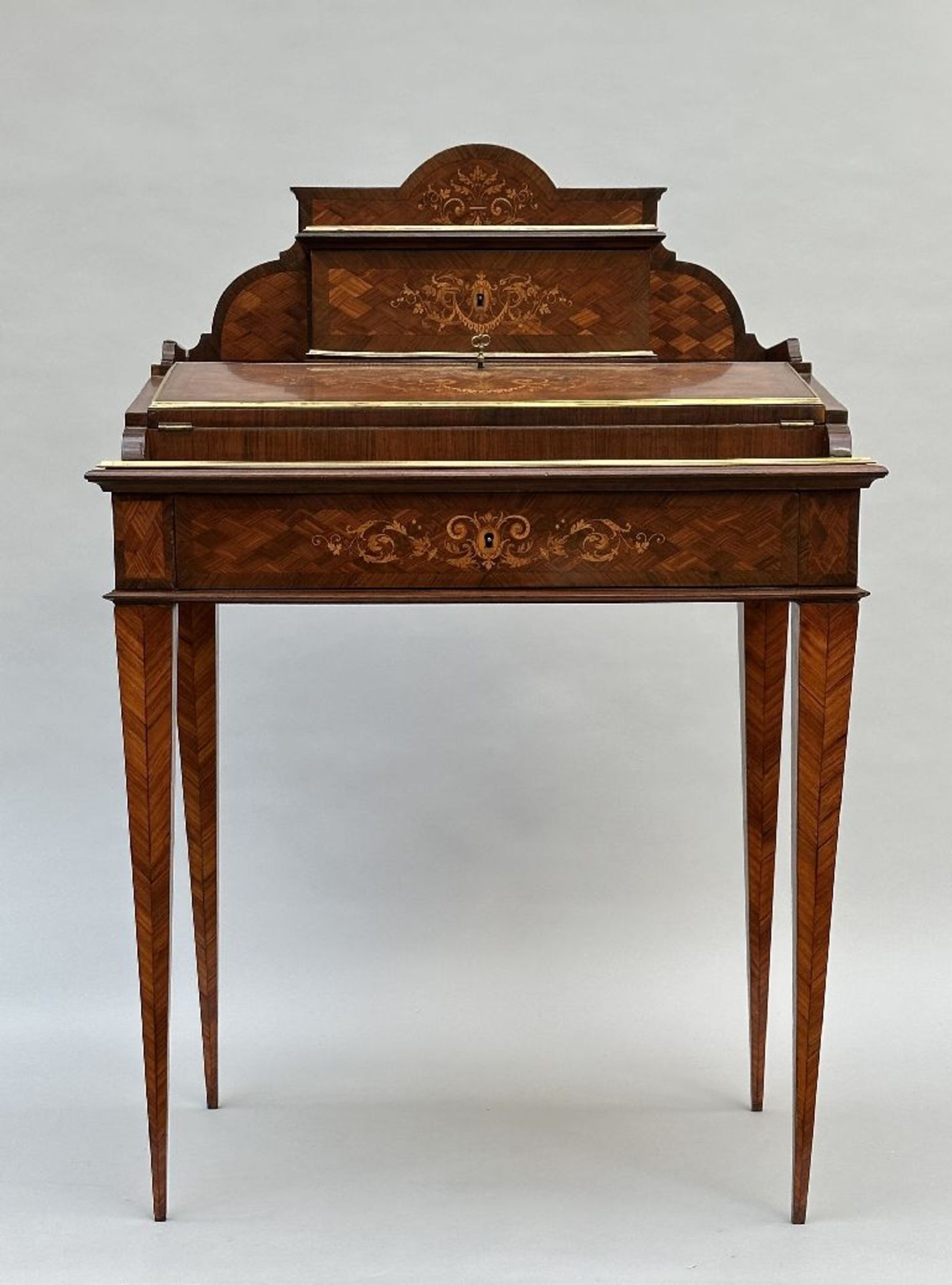 A Louis XVI style desk with inlaywork, 19th century
