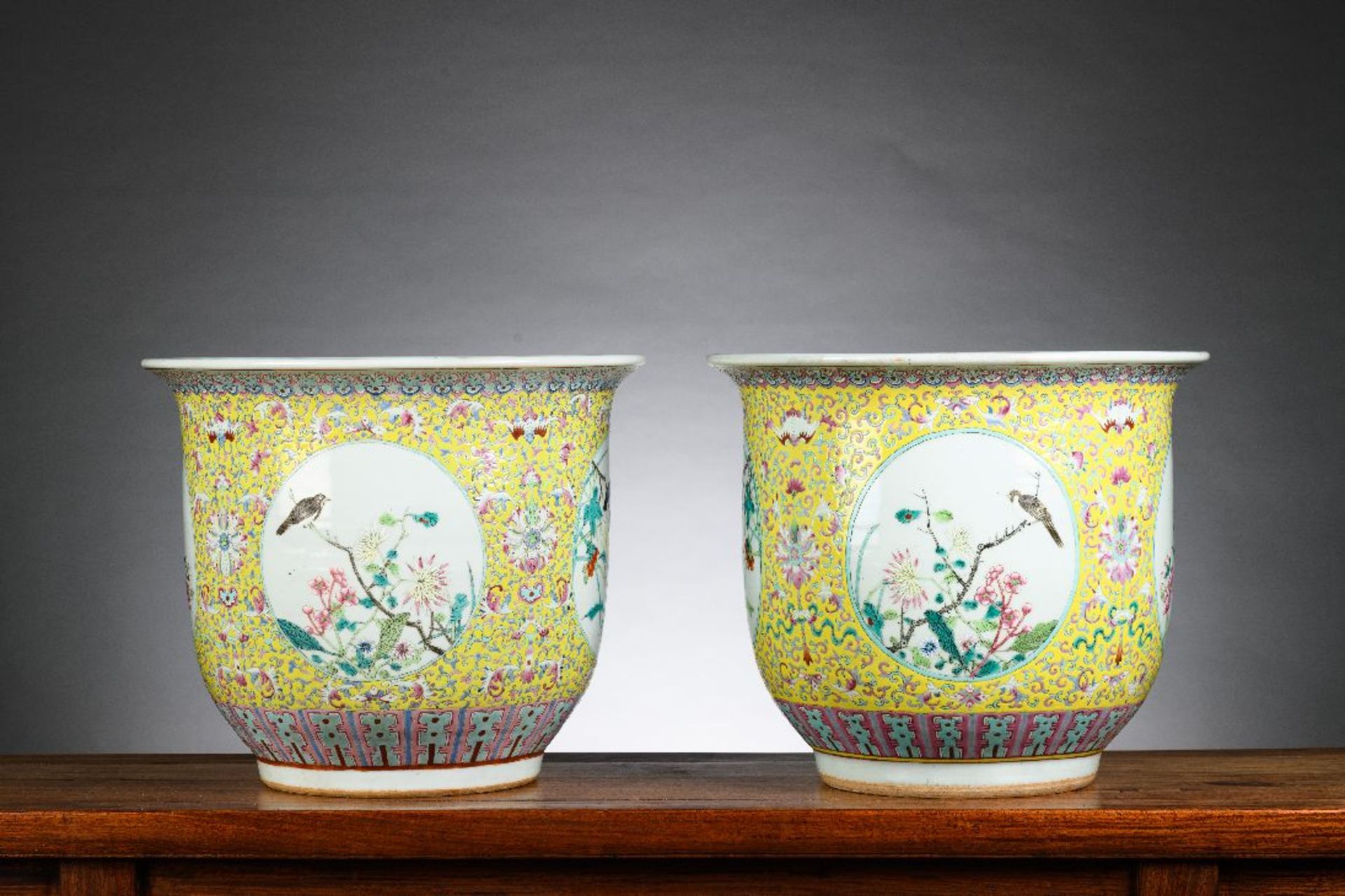 A pair of Chinese porcelain planters with yellow background 'birds', 19th century