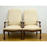 A pair of beech wood armchairs, Regence style