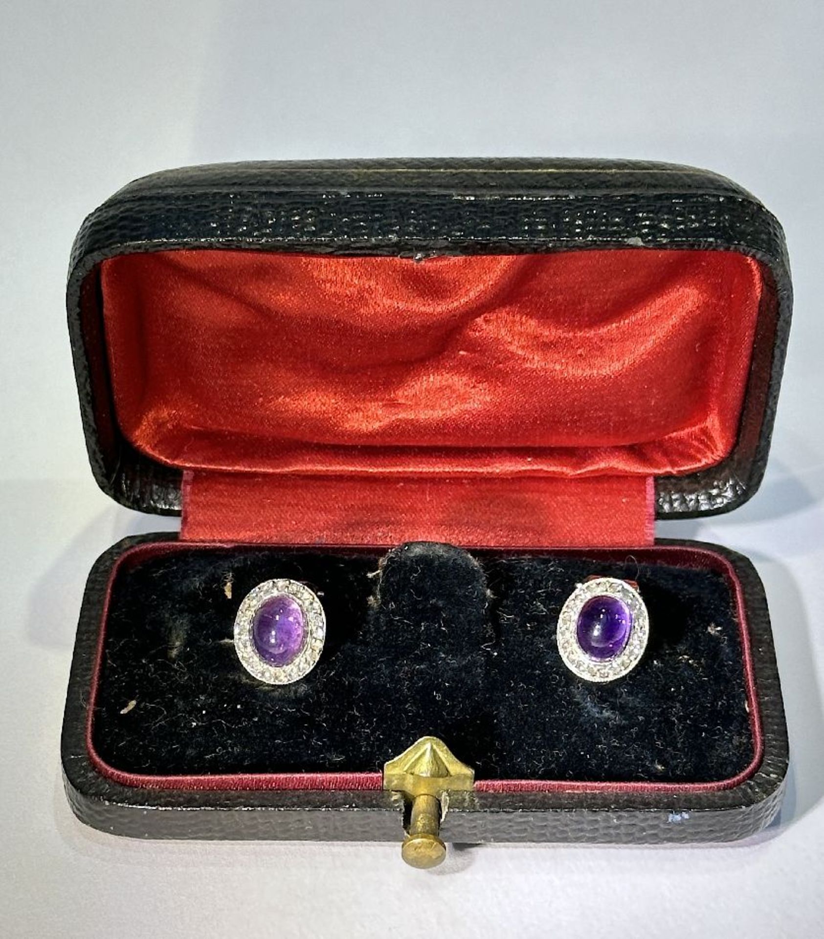 A pair of earrings (clips) with amethyst