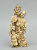 Japanese okimono 'musician with monkeys and child', Meiji period