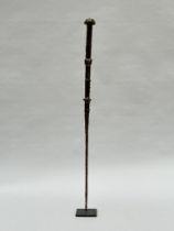 African weapon decorated with masks