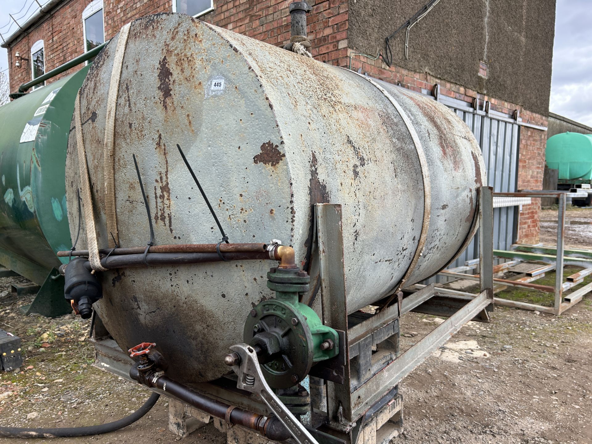 Metal fuel tank with stand and hand pump