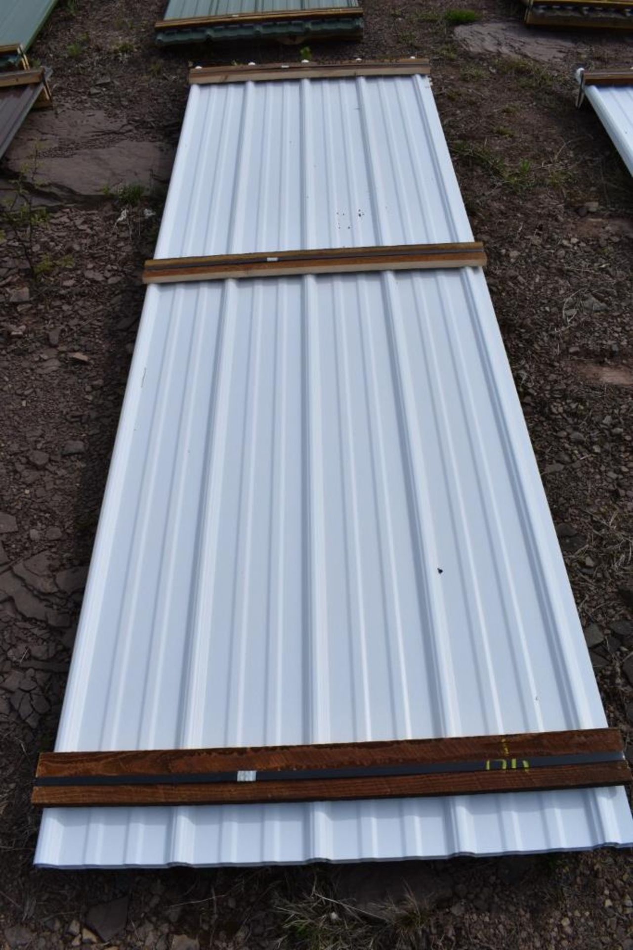 22 Pieces of 10' Sections of White Corrugated Metal Paneling SOLD TIMES THE LINEAR FOOT