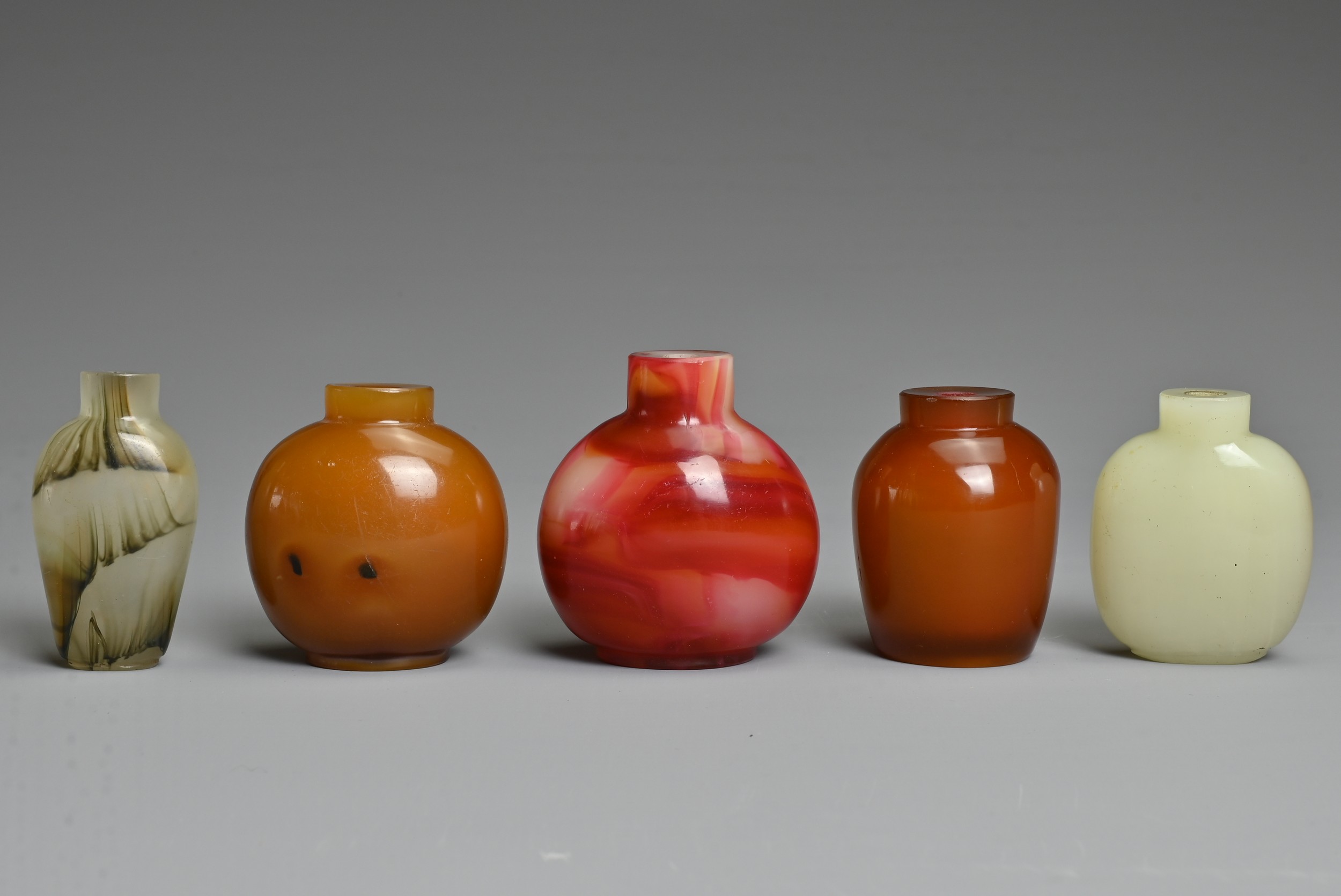 FIVE CHINESE GLASS SNUFF BOTTLES. Each of varied coloured glass of different forms. Approx. 5.