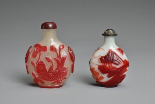 TWO CHINESE RED OVERLAY GLASS SNUFF BOTTLES. To include an opaque glass bottle featuring grasshopper