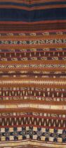 AN INDONESIAN SUMATRAN LAMPUNG CEREMONIAL GOLD AND SILVER THREAD TAPIS SARONG, EARLY 20TH CENTURY.