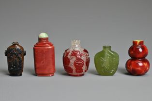 A GROUP OF FIVE CHINESE GLASS SNUFF BOTTLES. To include a red overlay clear glass bottle with