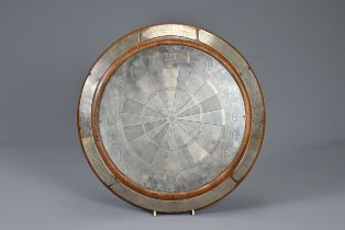 A SILVER DARTBOARD TROPHY, CHARLES S. GREEN & CO, HALLMARKED, BIRMINGHAM 1935. Mounted on an oak