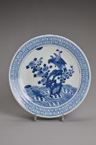 A CHINESE BLUE AND WHITE PORCELAIN DISH, 19TH CENTURY. Decorated with an eagle and flowers on