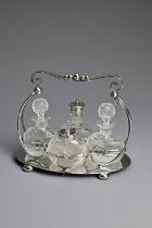 AN ENGLISH SILVER PLATED CRUET SET BY MARK WILLIS & SONS, SHEFFIELD C.1910. With four glass