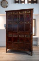 CHINESE RED LACQUER CABINET, 19/20TH CENTURY. With a planked top above twin doors with two shelves