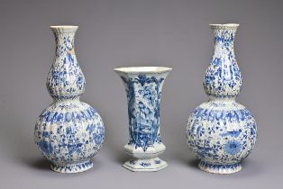 A PAIR OF DUTCH DELFT BLUE AND WHITE FLUTED DOUBLE GOURD-SHAPED BOTTLE VASES AND A HEXAGONAL SECTION