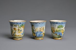 THREE ITALIAN MAIOLICA CASTELLI-STYLE FLARED BEAKERS, 18-19TH CENTURY. Painted with rustic figures