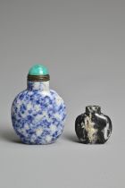 A CHINESE LAPIS LAZULI STONE SNUFF BOTTLE WITH ONE OTHER STONE BOTTLE. Each of flattened ovoid. 3.