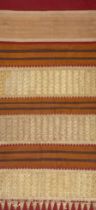 AN INDONESIAN SUMATRAN LAMPUNG CEREMONIAL GOLD THREAD TAPIS SARONG, EARLY 20TH CENTURY.