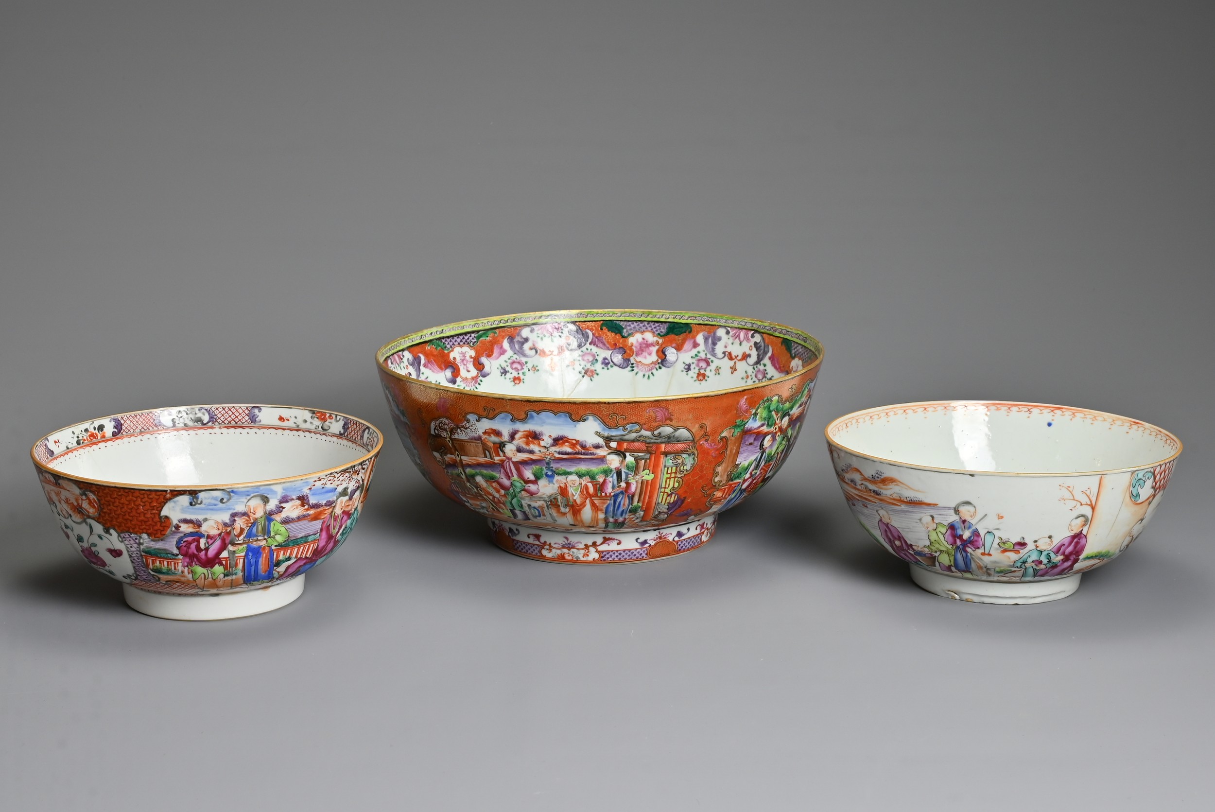 THREE CHINESE FAMILLE ROSE PORCELAIN BOWLS, 18TH CENTURY. Of graduating sizes decorated with various