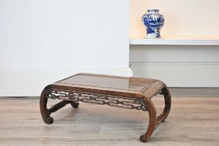 AN EARLY 20TH CENTURY CHINESE CARVED HARDWOOD LOW TABLE. Scroll ended, with moulded top and