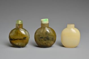 THREE CHINESE GLASS IMITATION AGATE SNUFF BOTTLES. Each of flattened globular ovoid form, one with