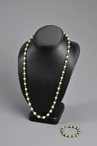 A VINTAGE JADE AND PEARL BEAD NECKLACE. Alternating jade beads with graduating pearls; Together with