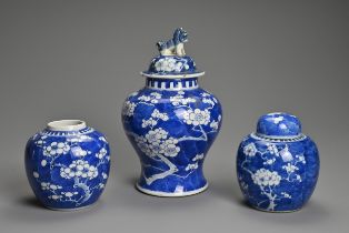 THREE CHINESE BLUE AND WHITE PORCELAIN PRUNUS VASES, 19/20TH CENTURY. To include a baluster form