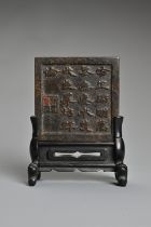 A SMALL CHINESE BRONZE MIRROR, QING DYNASTY. Of square form with characters, by the Xue family.