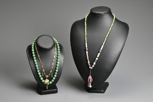 THREE NECKLACES. To include a ceramic beaded necklace; A jade stone beaded necklace mounted with