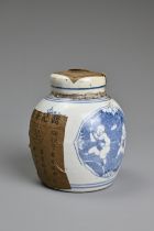 A CHINESE BLUE AND WHITE PORCELAIN JAR AND COVER WITH TEA LABELS. The jar decorated with figures