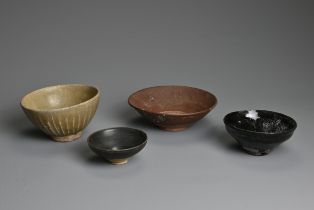 FOUR CHINESE / THAI POTTERY BOWLS. To include a Thai celadon glazed bowl with ribbed sides; A