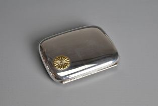 A JAPANESE SILVER CIGARETTE CASE WITH GILT IMPERIAL CREST, EARLY 20TH CENTURY. Of rectangular form