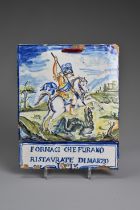 AN ITALIAN MAIOLICA RECTANGULAR PLAQUE IN THE CASTELLI-STYLE. Painted with St George defeating the