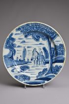 AN ENGLISH DELFTWARE BLUE AND WHITE LARGE PLATE, MID-18TH CENTURY PERHAPS BRISTOL OR LONDON. Painted