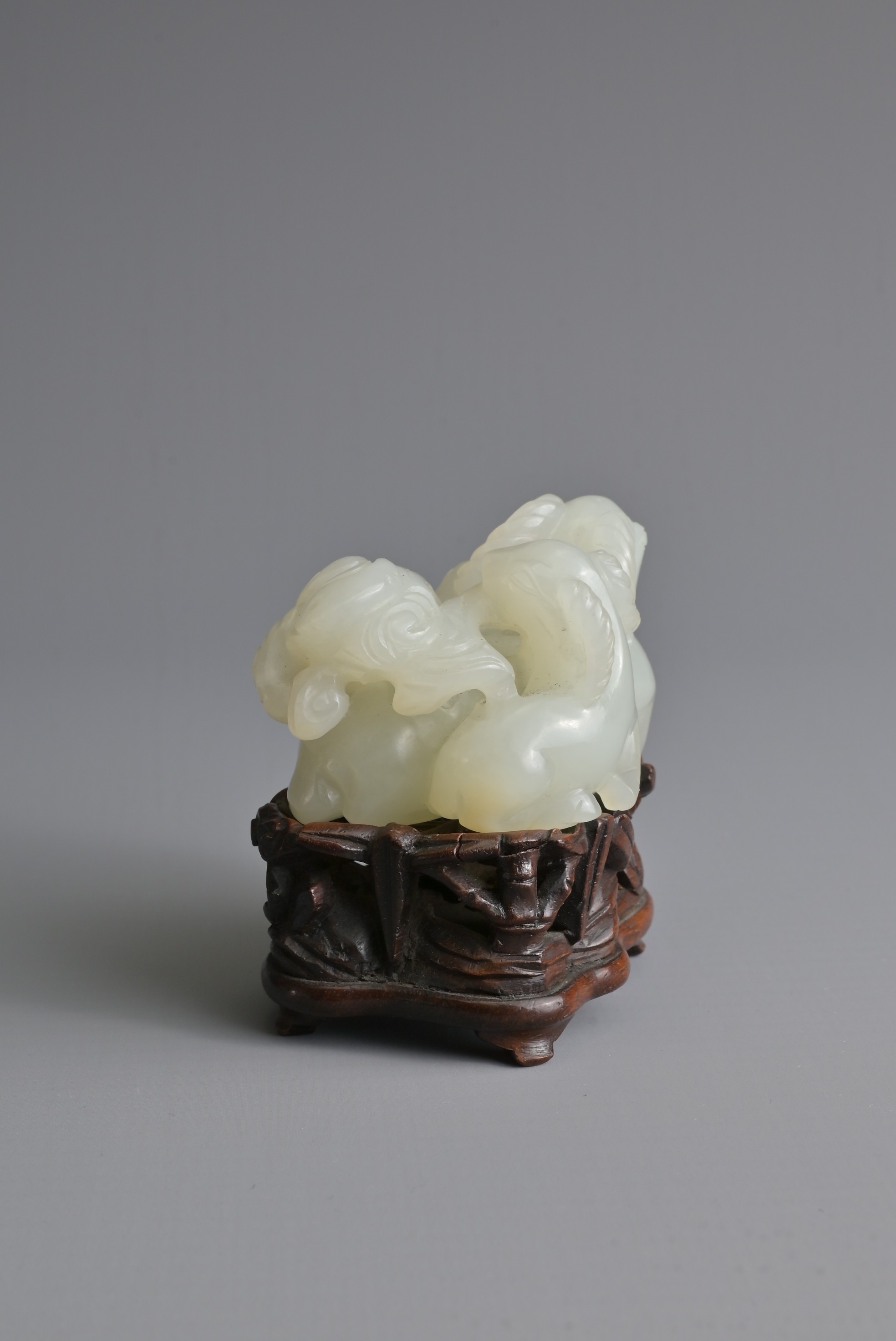 A CHINESE WHITE JADE DEER GROUP ON WOODEN STAND, 19/20TH CENTURY. Carved and pierced in the form - Image 4 of 8